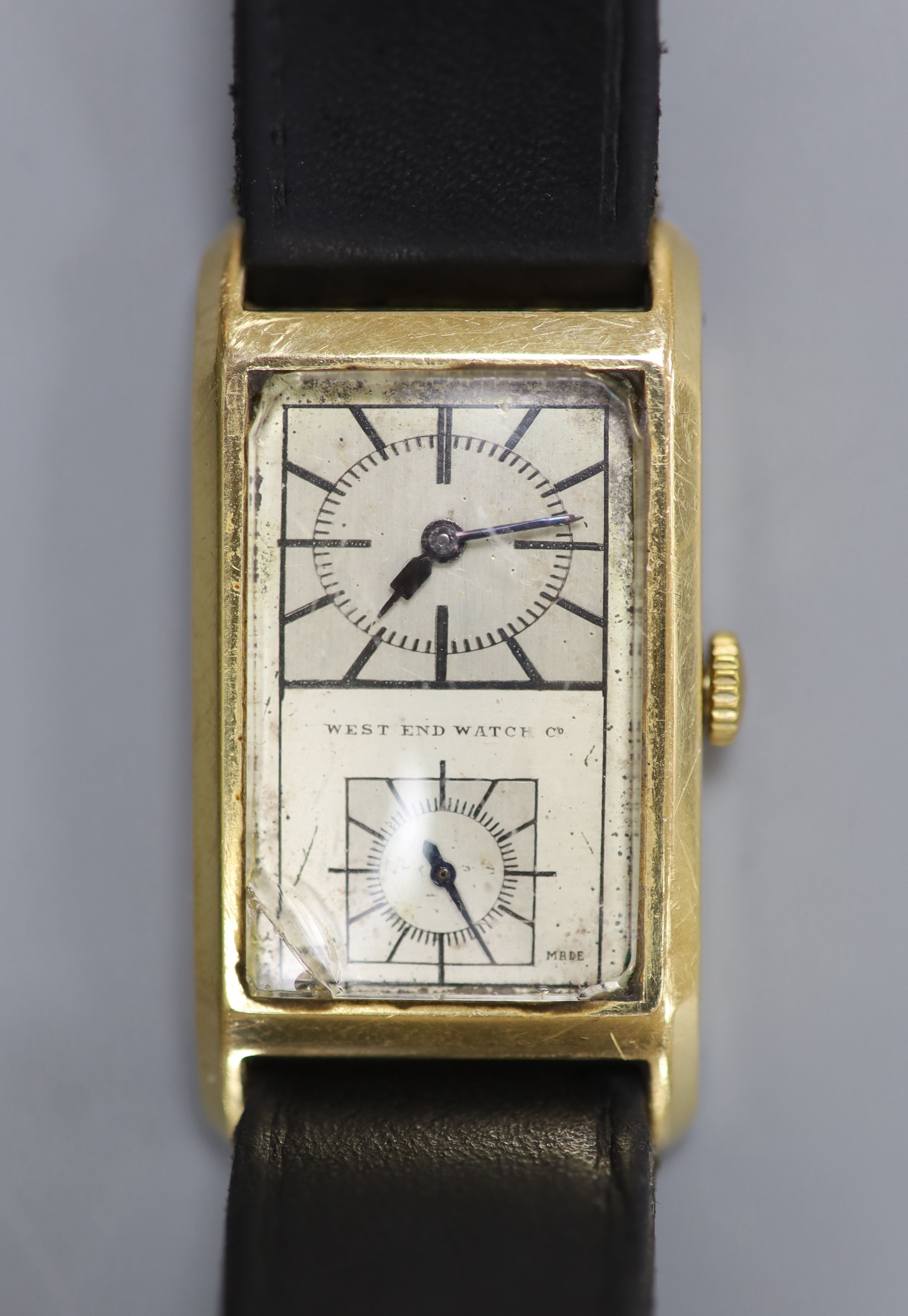 A gentleman's 1940's/1950's 18k West End Watch Co. manual wind rectangular split dial wrist watch, on associated leather strap